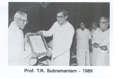 Suresh Krishna conferring the title “ Sangeetha Choodamani” on Prof.T.R.Subramaniam.R.Yagnaraman look on.