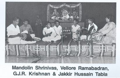 Performance by Mandolin Srinivas, Vellore Ramabadran, G J R Krishnan, & Zakir Hussain (table)