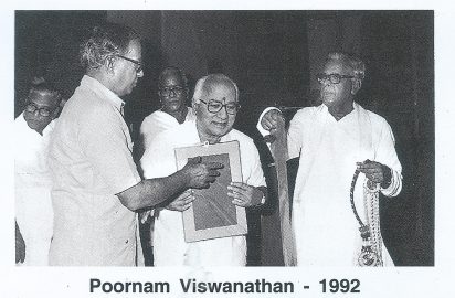 Karthik Fine Arts R.Rajagopal conferring the title “ Nadiga Choodamani”on Poornam Viswanathan in the year 1992.R.yagnaraman look on