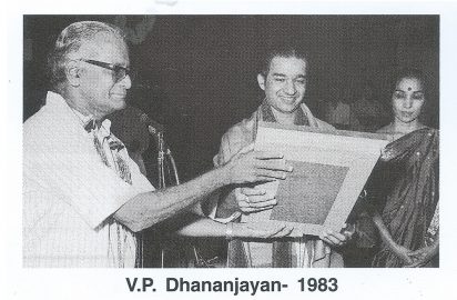 Krishnamurthy, Director General, Door Darshan Kendra conferring the title “ Nrithya Choodamani” on V.P.Dhannanjayan.Shantha Dhananjayan look on.